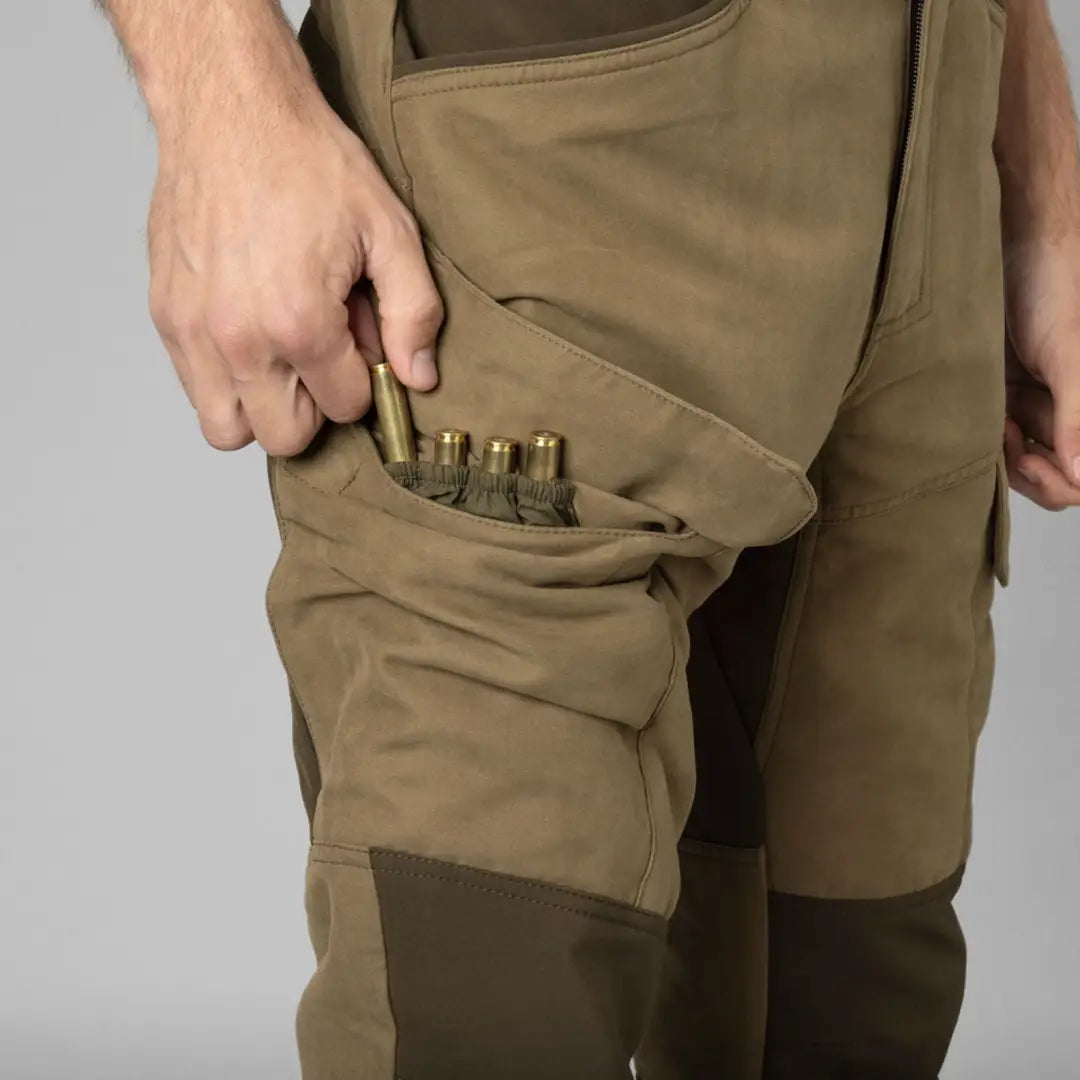 Härkila Scandinavian trousers with hunting pants and ammunition for outdoor adventure