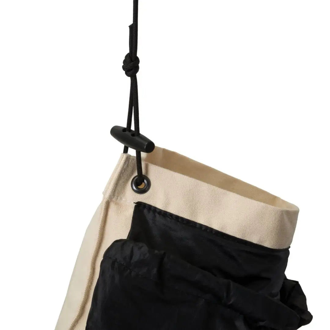 Hanging fabric storage organizer with black and beige compartments for a water filter bag