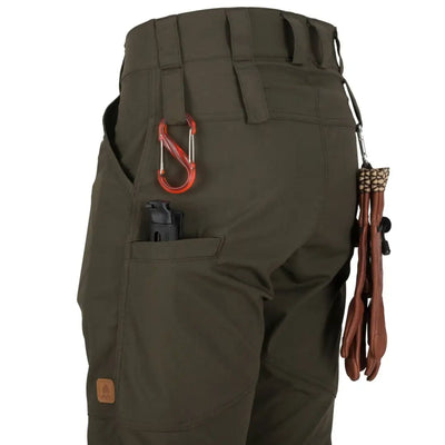 Olive green Helikon-Tex Woodsman Pants with pockets, perfect for outdoor enthusiasts