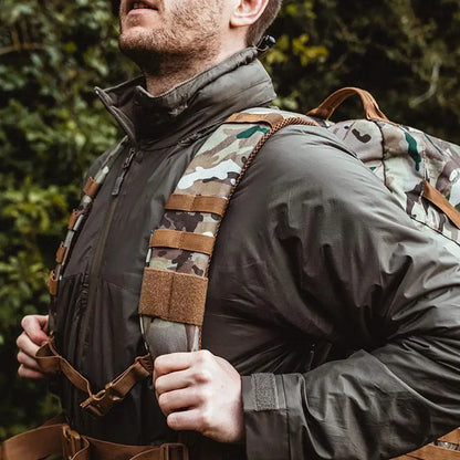 Camouflage backpack on person wearing Highlander Halo Full Zip Jacket with waterproof zips