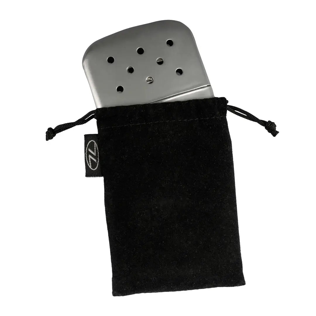 Metal hand warmer in a black drawstring bag for the Highlander Pocket Furnace