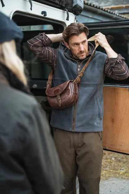 Brown leather fanny pack with zipper and adjustable straps, perfect for Countrysport Luxury Hunting