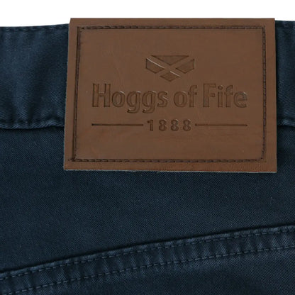 Leather label with Hoggs of Fife 1888 logo on dark fabric of Dingwall cotton stretch jeans