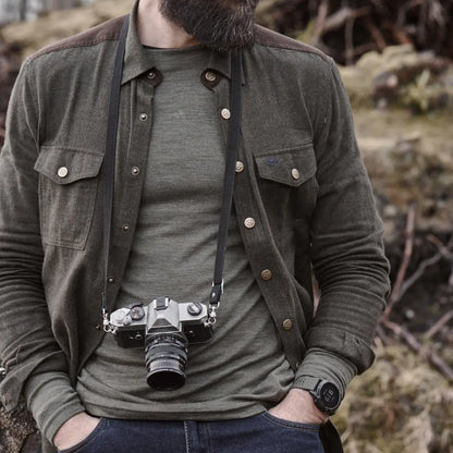 Vintage film camera hanging from a neck strap, paired with a Fife Dunvegan Flannel Shirt