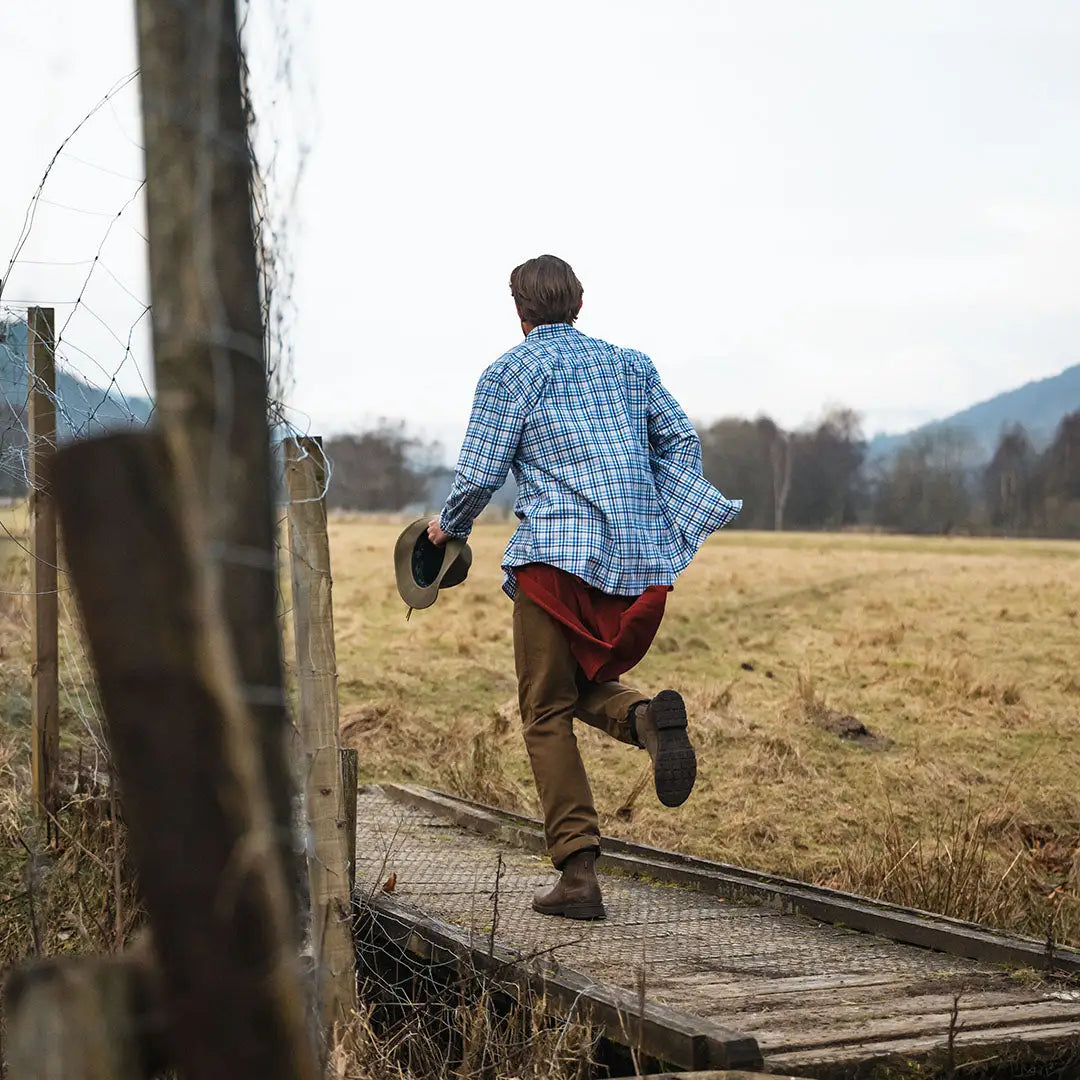 Man running across a bridge in Fife Garvock Cotton Twill Herringbone Check Shirt