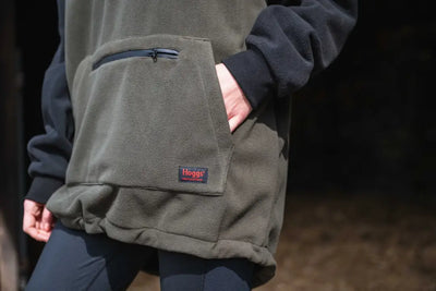 Olive green waxed canvas messenger bag with blue accents and Haglöfs logo for King II Stormproof