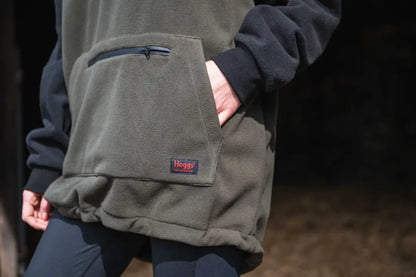 Olive green waxed canvas messenger bag with blue accents and Haglöfs logo for King II Stormproof