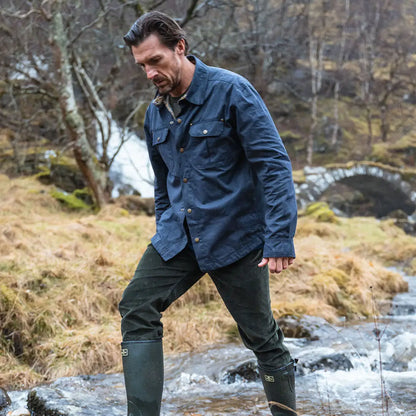 Man in outdoor clothing wearing Hoggs of Fife Huntly Waxed Canvas Utility Overshirt