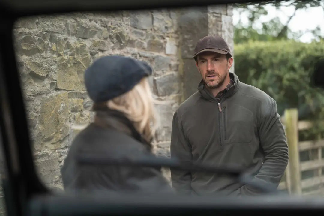 Olive green Hoggs of Fife Islander Techpro 1/4 Zip Shirt with black zipper and ribbed cuffs