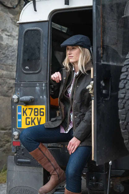 2019 Land Rover Defender 130 with yellow plate in Hoggs of Fife Ladies Letham Country waterproof boots