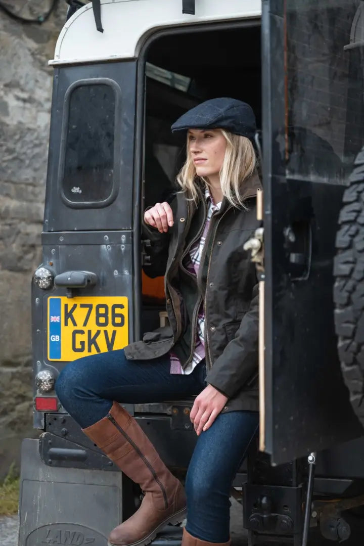 2019 Land Rover Defender 130 with yellow plate in Hoggs of Fife Ladies Letham Country waterproof boots