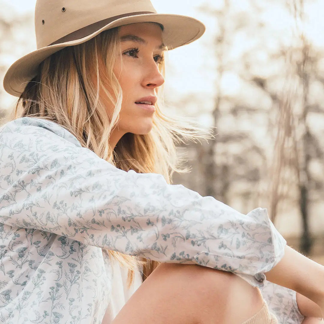 Woman in a hat wearing a stylish Hoggs of Fife thistle print shirt