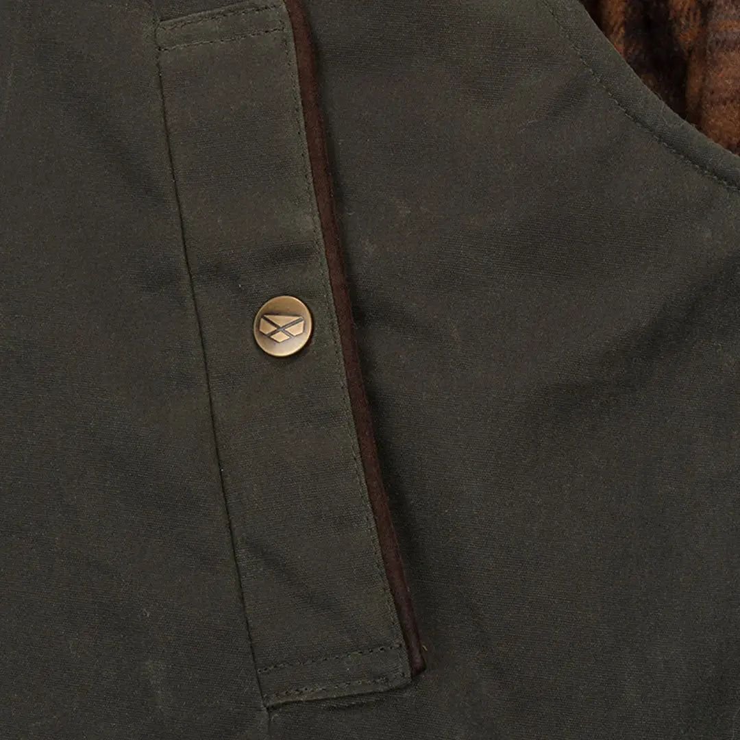 Dark green fabric with brass B button on Hoggs of Fife Maxton Gents padded waxed waistcoat