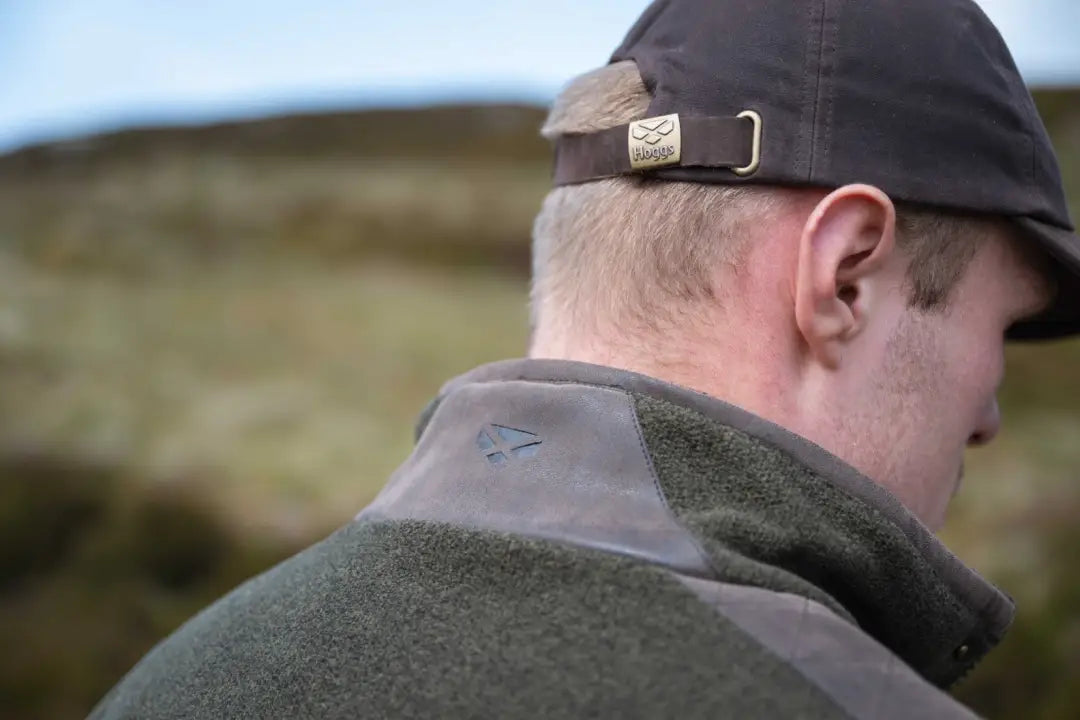Olive green Hoggs of Fife Sportsman Pro fleece jacket with black cap and brown belt
