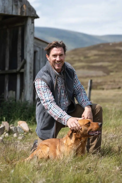 Grey Hoggs of Fife Stenton Technical Fleece Gilet with plaid shirt and brown dog for country hunting style