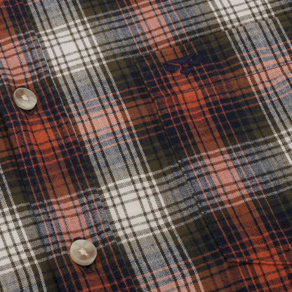 Plaid fabric with orange, black, and white lines on Hoggs of Fife Tiree shirt in lightly brushed cotton