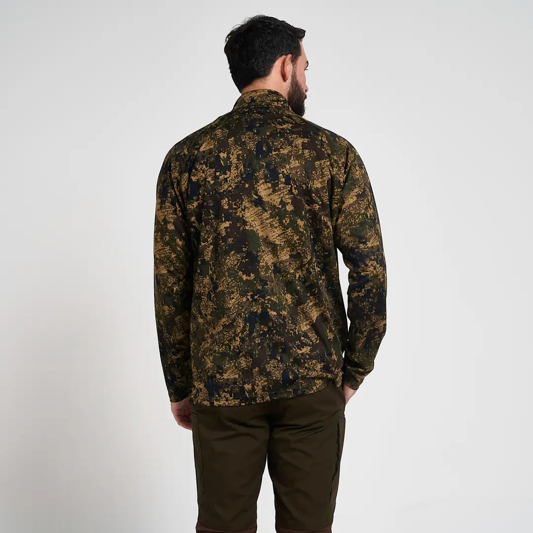 Man in Jack Pyke Armour long-sleeved camo top for fieldsports activity