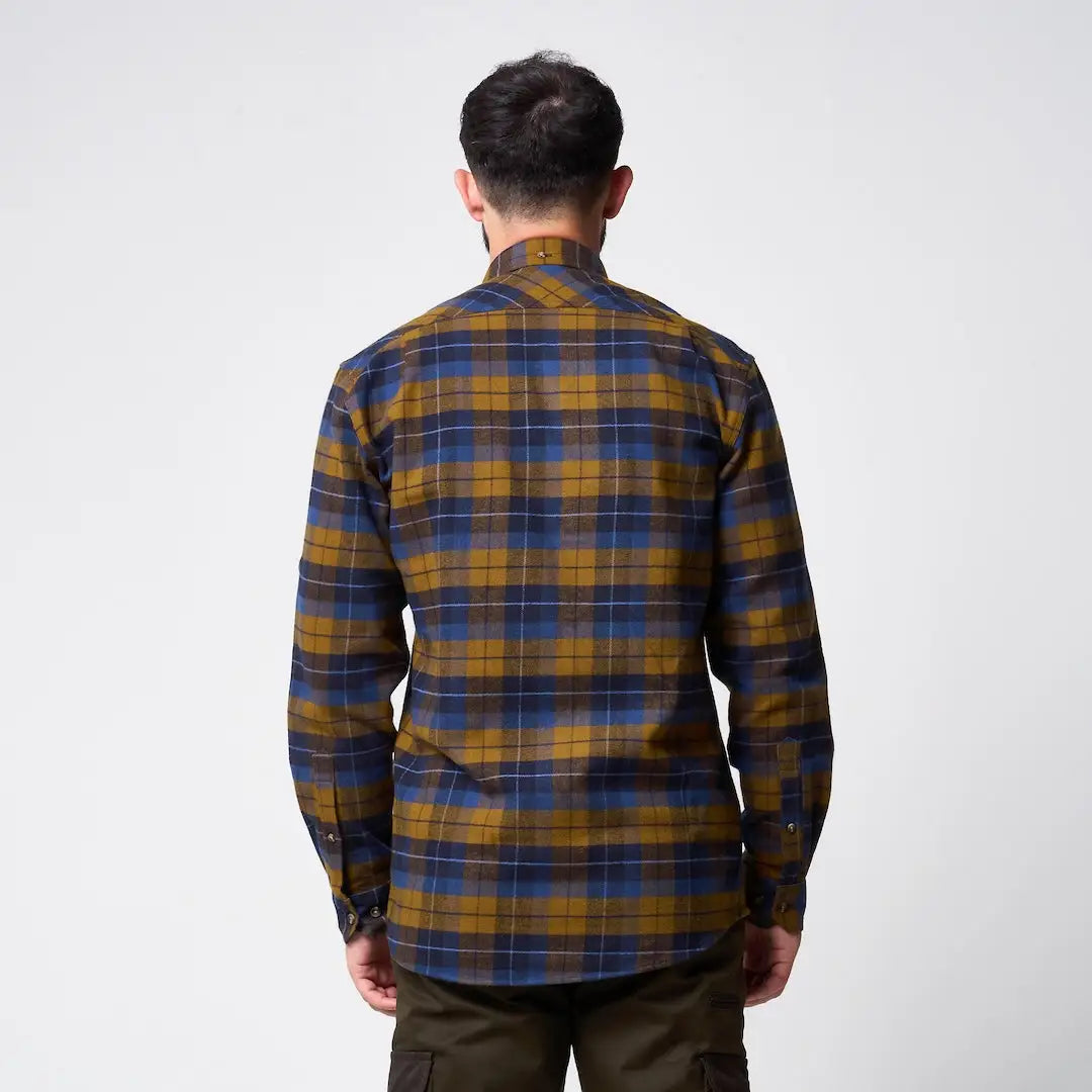 Man in Jack Pyke Bleasdale heavy flannel shirt with mustard yellow navy plaid