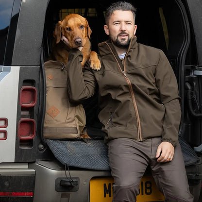 Man and dog posing with a vehicle wearing Jack Pyke Cotton Stretch Trousers