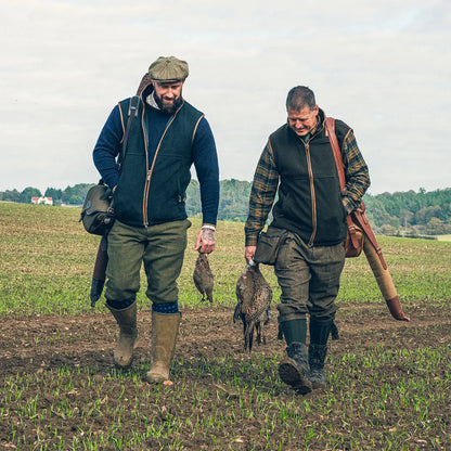 Two hunters with game birds wearing Jack Pyke Countryman 300gsm Micro Fleece Gilet