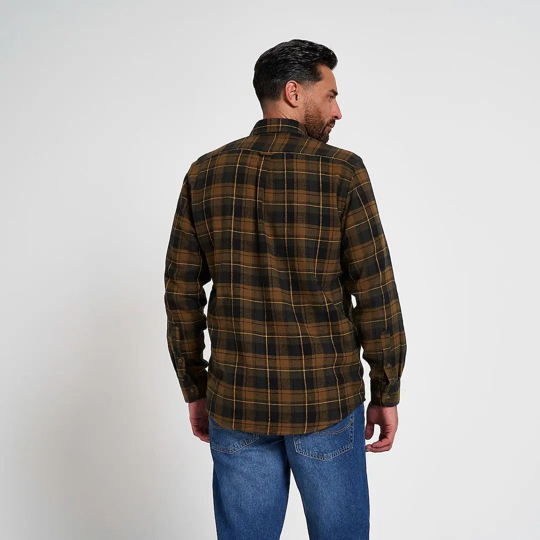 Man in Jack Pyke Flannel Shirt with brown black plaid and yellow grid
