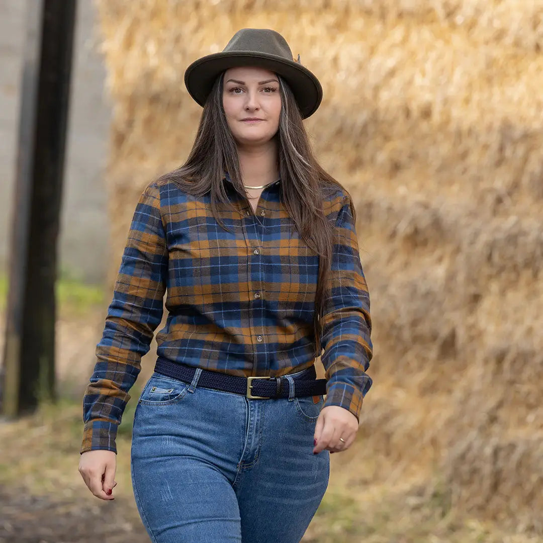 Woman in plaid shirt and hat wearing Jack Pyke Ladies Bleasdale Heavy Flannel Shirt