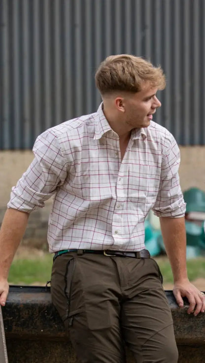 Man in plaid shirt and olive pants wearing Jack Pyke Countryman Long Sleeved Shirt