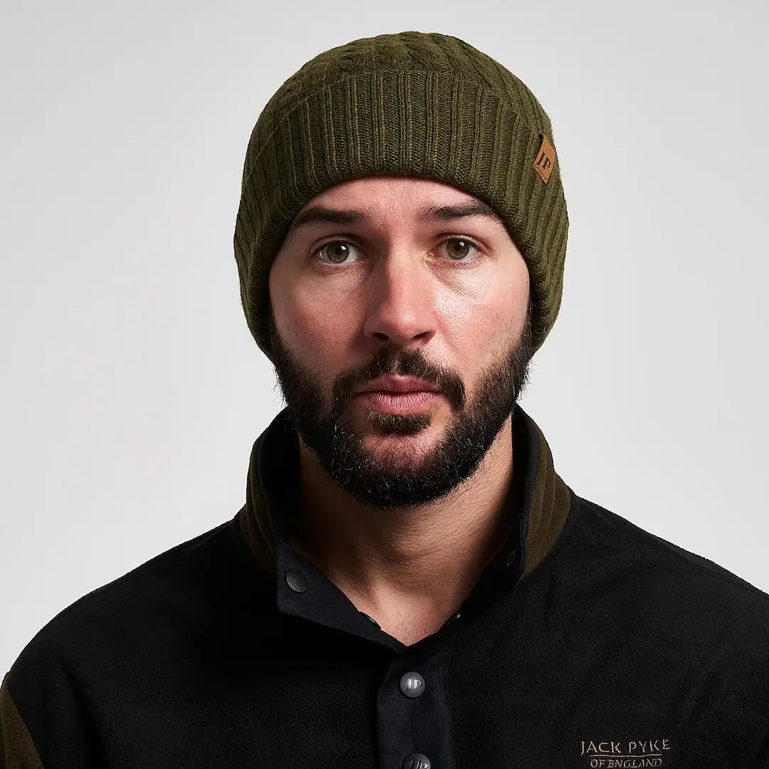Jack Pyke olive merino wool beanie with brown leather tag, practical winter accessory