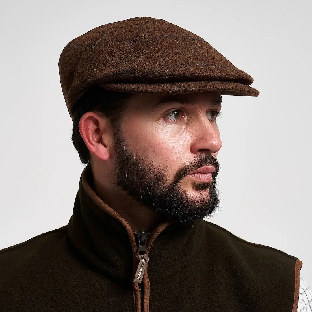 Jack Pyke Newsboy Cap: brown tweed flat cap with textured surface and classic peak
