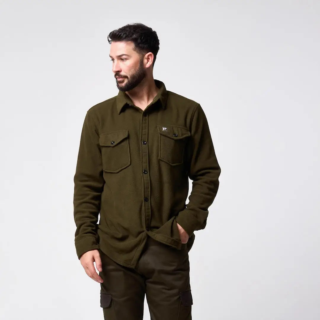 Jack Pyke Polar fleece shirt in olive green with long sleeves, button-up front, two chest pockets, and subtle logo