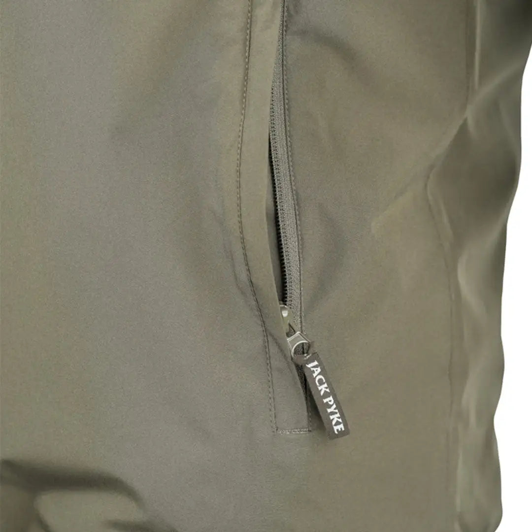 Olive green Jack Pyke reversible waterproof jacket with silver zipper