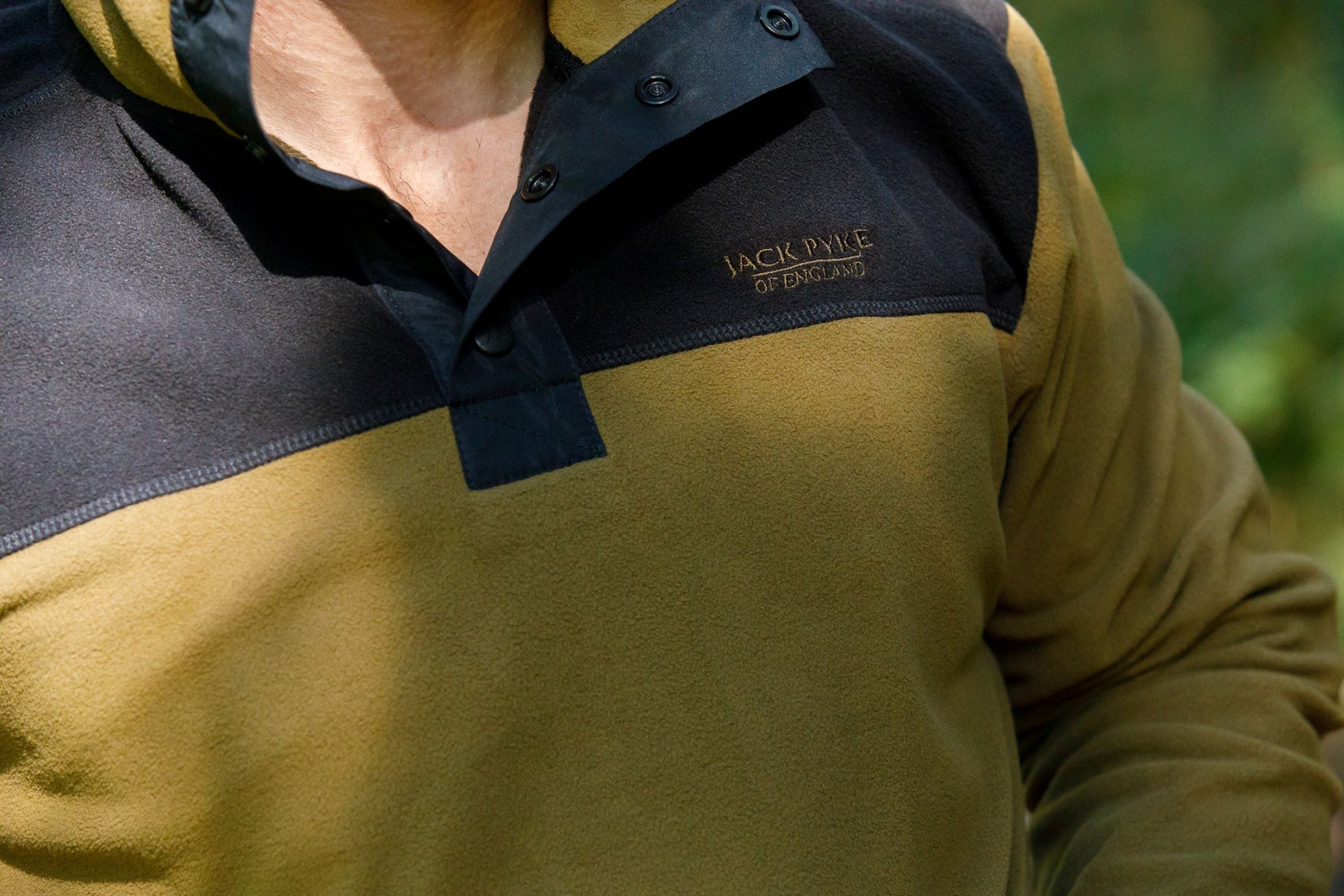 Olive and black fleece pullover, perfect for outdoor adventures, Jack Pyke Snap Neck style