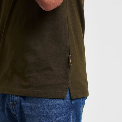 Olive green Jack Pyke polo shirt with textured fabric and leather tag