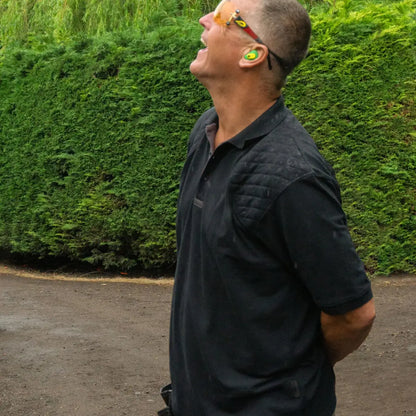 Man in a black Jack Pyke Sports Polo Shirt looking up with his mouth open