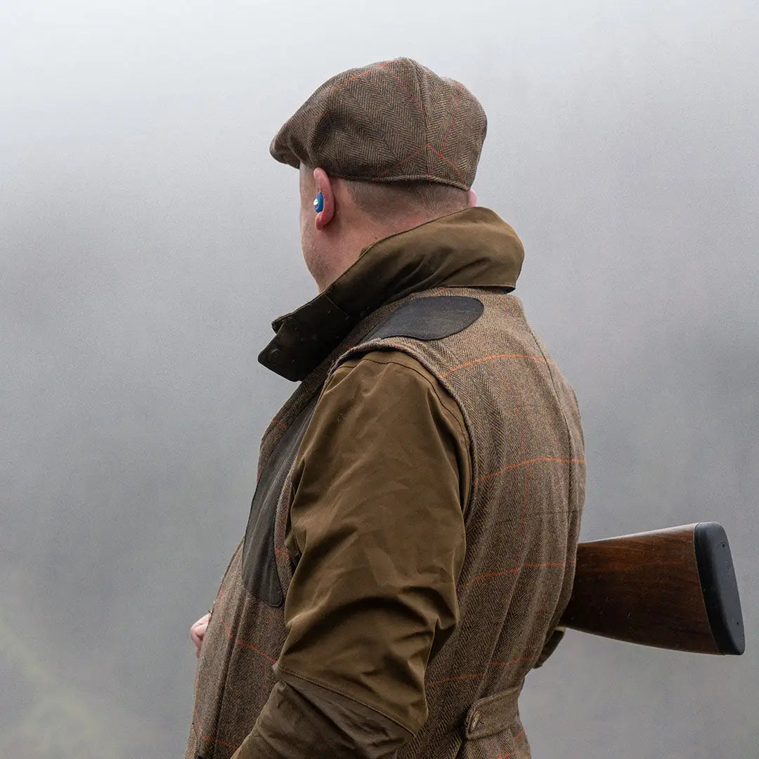Jack Pyke brown herringbone flat cap on shooting vest