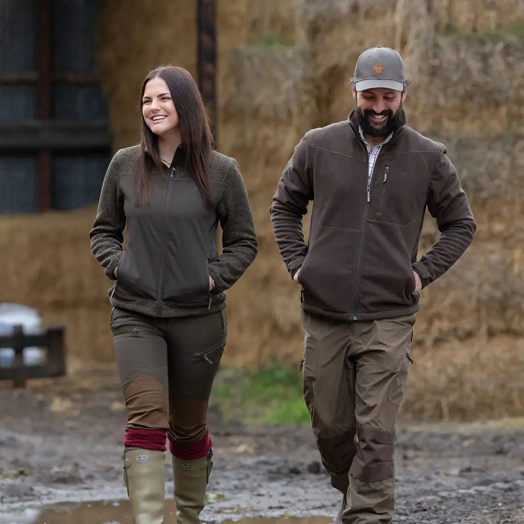 Two people wearing Jack Pyke Waterproof Fleece Jackets outdoors enjoying the elements