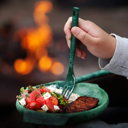 Green fork digging into salad and meat with Kupilka Cutlery Set for outdoors lovers