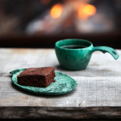 Chocolate brownie on a green Kupilka Small Plate perfect for country clothing and outdoors