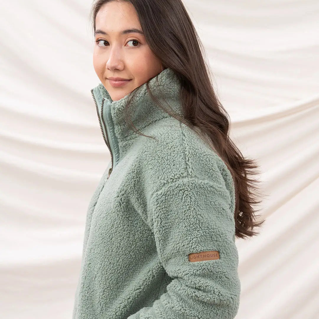 Woman in mint green Lighthouse Cobh zip fleece jacket, perfect country clothing style