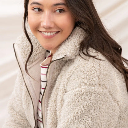 Woman in Lighthouse Cobh zip fleece and striped shirt, perfect for country clothing