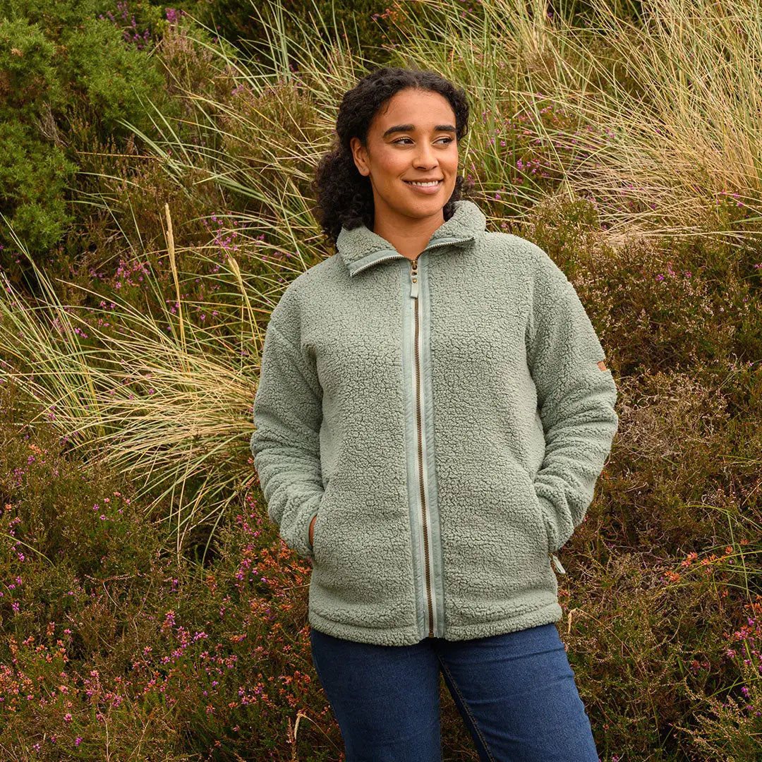 Woman in light green Lighthouse Cobh zip fleece jacket, perfect country clothing style