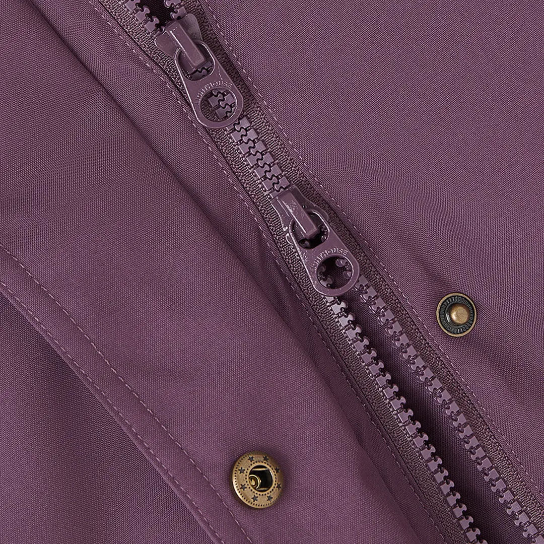 Close-up of Lighthouse Imogen Ladies Coat with purple fabric, two-way zipper, brass snaps