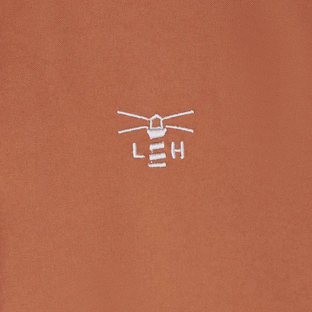 Embroidered brown Lighthouse Imogen Ladies Coat polo shirt with white lighthouse logo