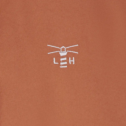 Embroidered brown Lighthouse Imogen Ladies Coat polo shirt with white lighthouse logo