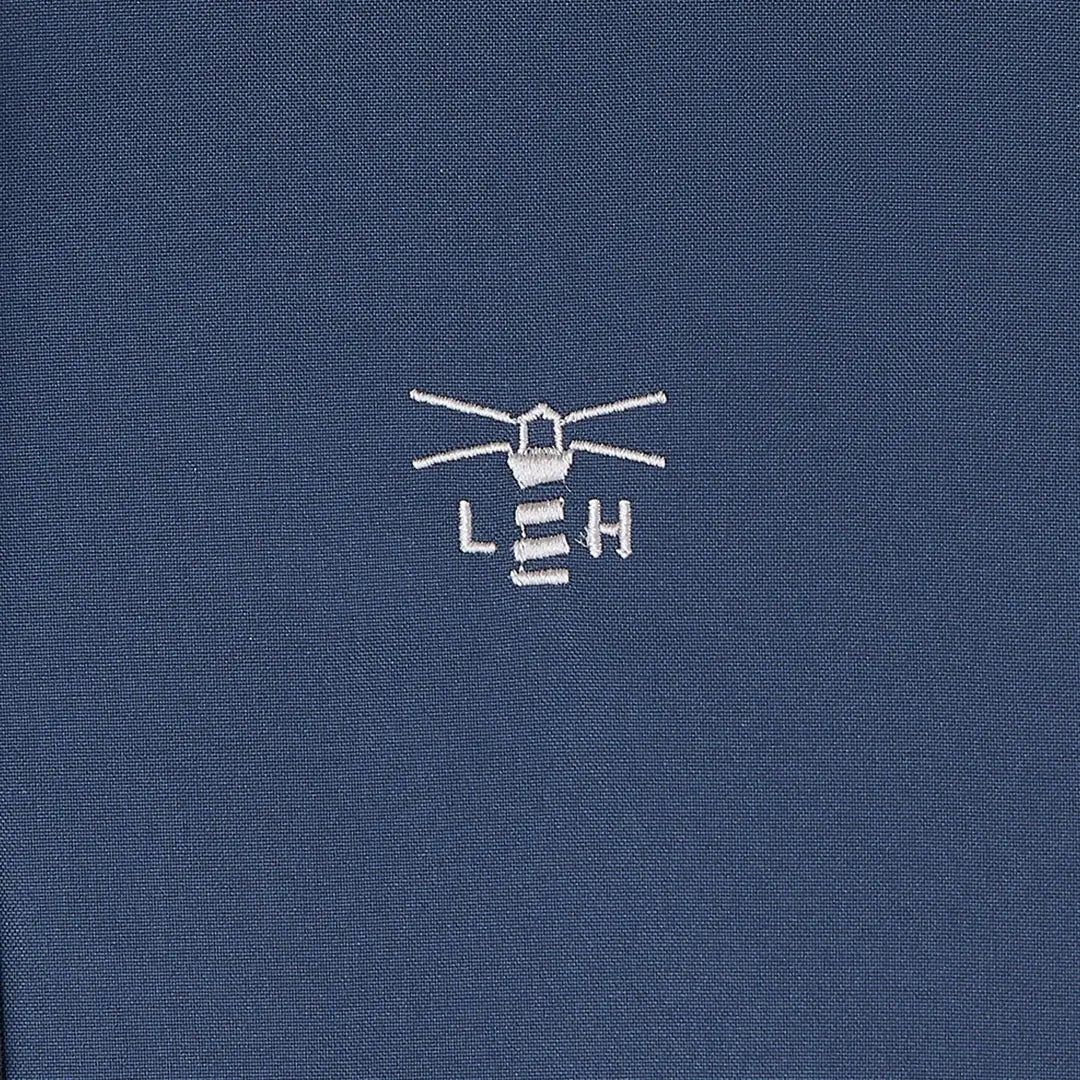 Embroidered lighthouse logo on dark blue Lighthouse Imogen Ladies Coat fabric