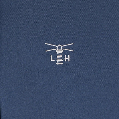 Embroidered lighthouse logo on dark blue Lighthouse Imogen Ladies Coat fabric