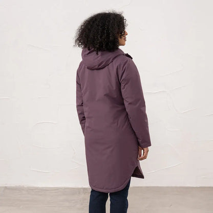 Woman in dark purple Lighthouse Imogen Ladies Coat with hood and dark pants