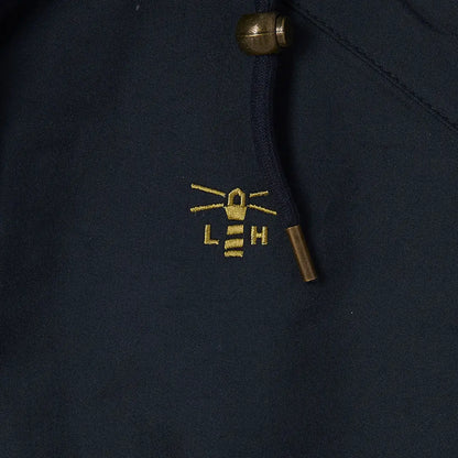 Embroidered LEH logo with whiskers on dark fabric from Lighthouse Heritage Collection