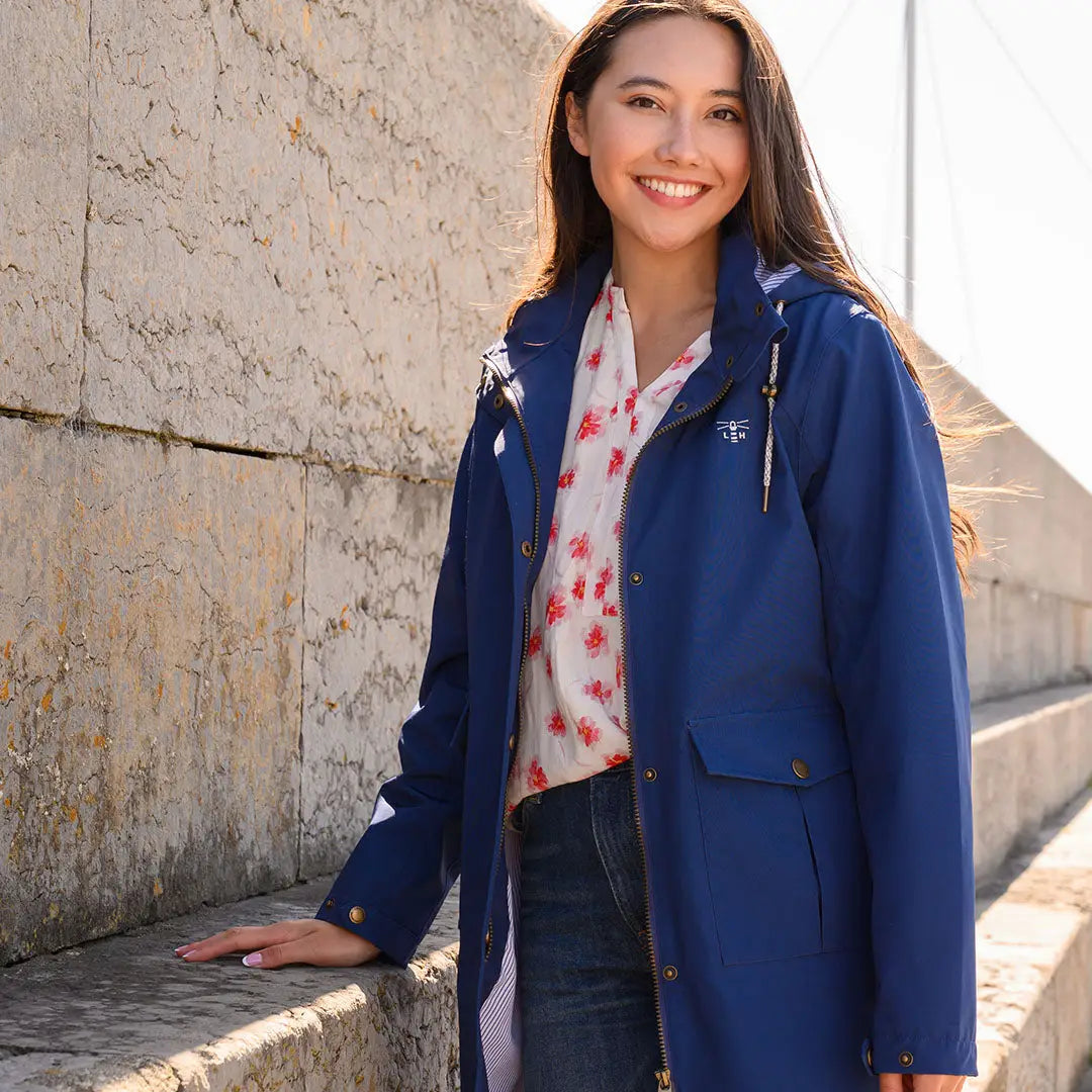 Blue hooded raincoat from Lighthouse Ladies Annika, perfect for stylish rainy days