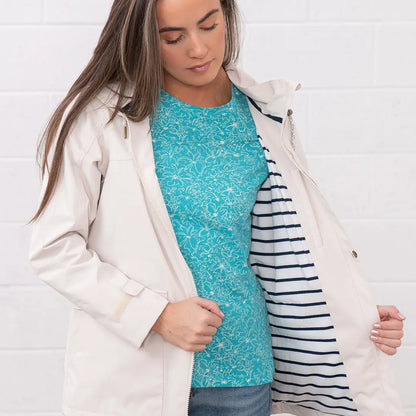 Woman’s beige Lighthouse Ladies Beachcomber II Coat with striped lining